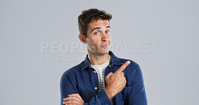 Buy stock photo Pointing, portrait and man in studio, promotion and announcement on gray background. Person, mockup space and model with hand gesture, choice and discount deal with sales, decision and confidence