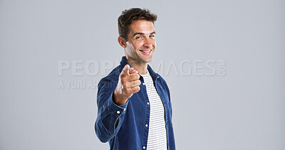 Buy stock photo Portrait, pointing to you and man with smile, choice and confidence on white studio background. Face, happy person or model with gesture, opportunity or decision with sign up, motivation or selection