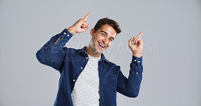 Buy stock photo Portrait, man and pointing to presentation in studio for advertising, information and announcement. Launch, person and marketing space for about us, promotion offer and opportunity on gray background