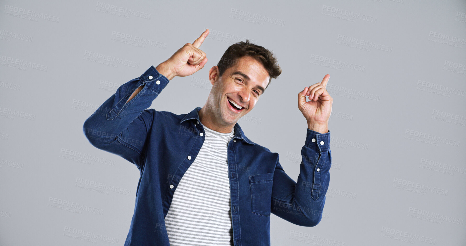 Buy stock photo Portrait, man and pointing to presentation in studio for advertising, information and announcement. Launch, person and marketing space for about us, promotion offer and opportunity on gray background