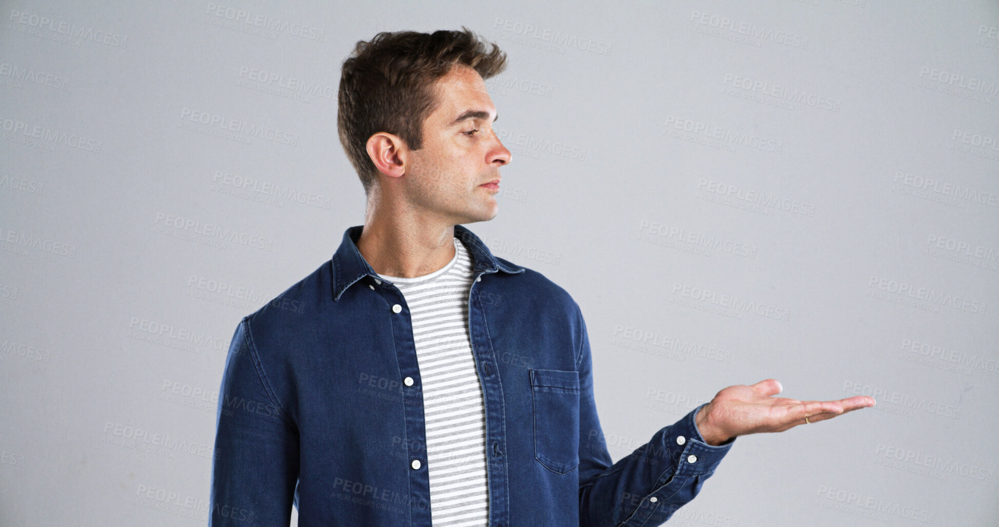 Buy stock photo Advertising, man and palm with presentation in studio for coming soon, offer deal or announcement. Mockup, ambassador and show marketing space for about us, launch and opportunity on white background