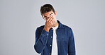 Frustrated man, headache or eye strain in studio with stress for mistake on a gray background. Upset, male person and model with migraine or anxiety for debt, mental health or fatigue on mockup space