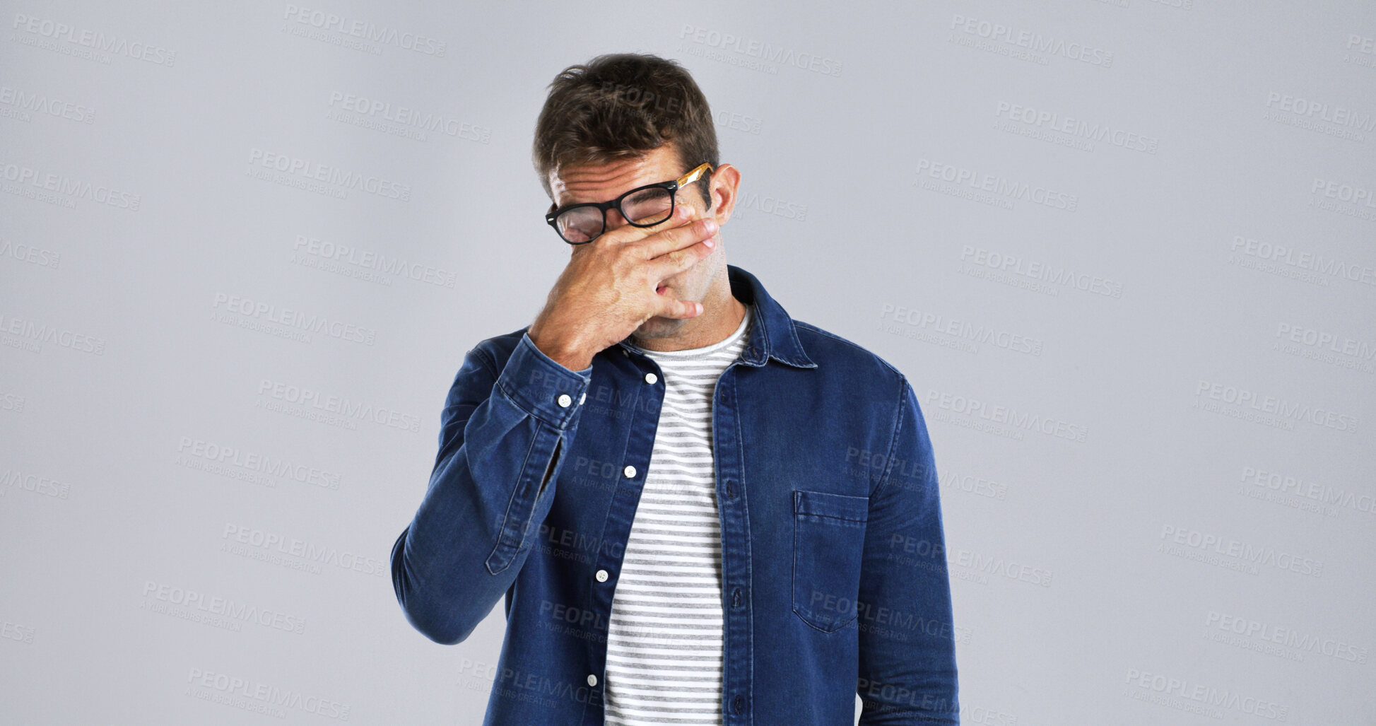 Buy stock photo Man, headache and stress with glasses in studio with eye fatigue, vertigo and frustrated by background. Person, spectacles and migraine with pain, exhausted and burnout with mockup space for vision