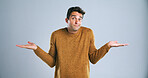 Portrait, shrugging and question with man in studio for doubt, problem solving or solution. Emoji, hand gesture and uncertain with confused person on white background for answer, decision or mistake