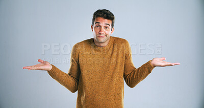 Buy stock photo Confused, portrait and shrugging shoulders with man in studio for doubt, solution or question. Emoji, problem solving and why with uncertain person on white background for answer, decision or mistake