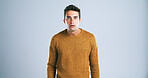 Portrait, man and scared with fear in studio for bad news, drama and reaction for danger risk. Mockup space, person and shocked expression for horror story, scary rumor and terror on gray background