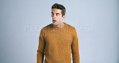 Buy stock photo Shocked, man and listen to gossip in studio for bad news, drama and reaction for danger risk. Mockup space, person and surprise expression for horror story, scary rumor and terror on white background