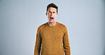 Face, yawn and tired man in studio with burnout, low energy or exhausted on white background. Fatigue, portrait and male model with insomnia expression for sleepy emoji, lazy or bored gesture