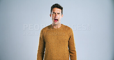 Buy stock photo Face, yawn and tired man in studio with burnout, low energy or exhausted on white background. Fatigue, sleepless and male model with insomnia expression for sleepy emoji, lazy or bored gesture