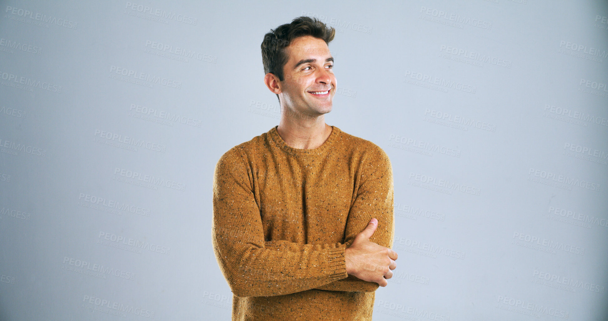 Buy stock photo Smile, man and pride for fashion in studio with winter jersey, casual clothes and cool style. Mockup space, thinking and person with arms crossed for confidence, trendy outfit and white background