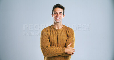 Buy stock photo Arms crossed, portrait and proud with man in studio for small business startup as entrepreneur. Confident, satisfied and smile with person on white background for creative career on mockup space