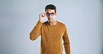 IT support, portrait and vision with tech guru in studio for development as computer engineer. Glasses, system and troubleshooting with man on white background for network solution or problem solving