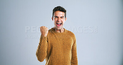 Buy stock photo Man, celebration and fist pump in studio portrait with shout, success and goals by background. Person, winner and excited with smile, scream and mockup space for investing, cheers or profit in France