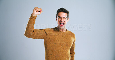 Buy stock photo Man, shout and fist pump in studio portrait with celebration, success and goals by background. Person, winner and excited with smile, scream and mockup space with giveaway, cheers and profit in Spain