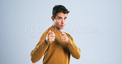 Buy stock photo Portrait, man and pointing at you in studio for decision, selection or choice on white background. Finger gun, invitation and person with hand gesture for join us, hiring or recruit with mockup space