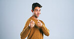 Hand pointing, portrait and man in studio with you, offer or invitation, vote or choice on white background. Happy, smile and model with decision, results or application, recruitment or motivation