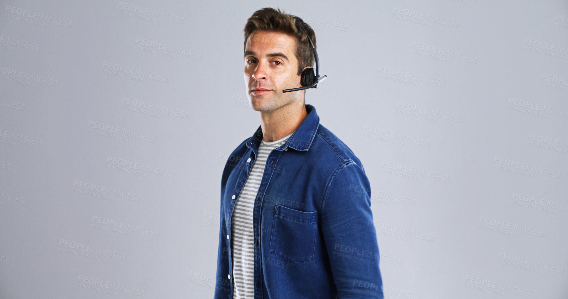 Buy stock photo Portrait, man and call center agent in studio with communication, contact us and CRM. Mockup space, help desk or inbound with customer service, consultant and headset for advice on white background