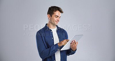 Buy stock photo Smile, tablet and website with man in studio for programming or software development career. App, mainframe and system maintenance with tech guru on white background space for professional IT support