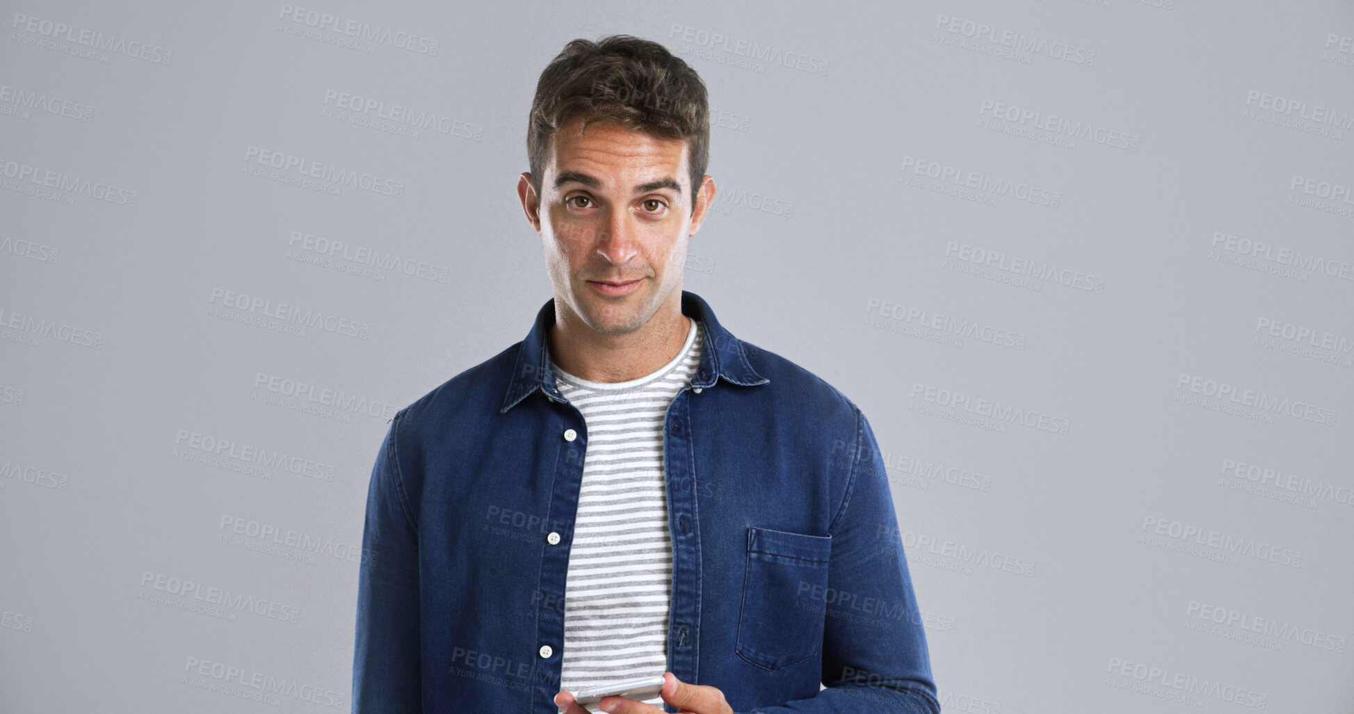 Buy stock photo Portrait, phone and man in studio for social media, text or message on white background space. Mobile, confident person and tech for email on app for communication, news and blog post on internet