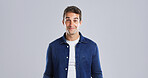 Happy, goofy and portrait of man in studio with funny, comic or crazy facial expression. Mockup space, silly and male person from London with smile, joke or playful reaction by white background.