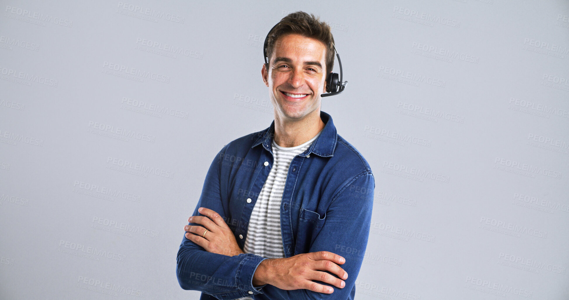 Buy stock photo Happy man, portrait or consultant with headset or confidence in studio on a white background. Male person, agent or tech with smile or arms crossed for online customer service or CRM on mockup space