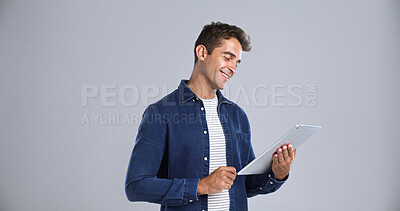 Buy stock photo Smile, funny or man in studio, tablet or website information on white background. Mockup space, model or person with internet, technology or digital app for online humor or video with joke or network
