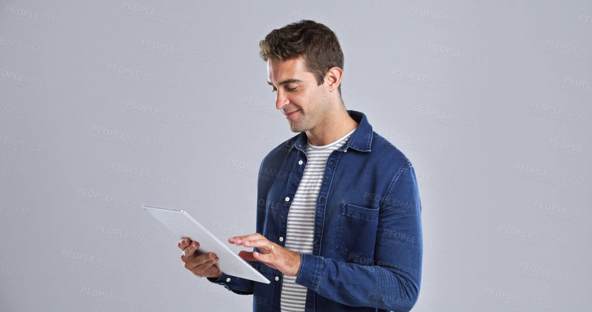 Buy stock photo Smile, system and tablet with tech guru in studio for programming or software development career. App, mainframe and web maintenance with happy man on white background for professional IT support