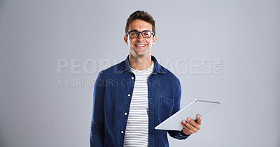 Buy stock photo Tablet, man and smile with portrait in studio for social media, internet and website app. Happy, male model and isolated on white background with technology for digital networking, e book or research