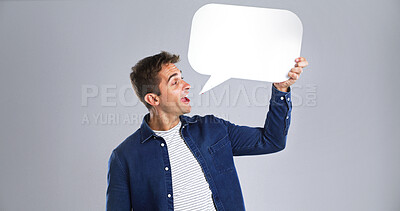 Buy stock photo Talking, happy man and speech bubble in studio for communication forum, social media and feedback. Chat, person and dialogue balloon for opinion, quote and FAQ on white background with mockup space