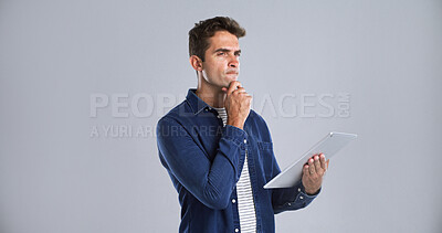 Buy stock photo Journalism, tablet and thinking with editor man in studio for proofreading article of online magazine. App, ideas and post editing with freelance journalist on white background space for publishing