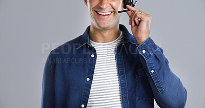 Buy stock photo Happy man, mouth and consultant with headset in studio for customer service on white background. Male person, agent or smile with mic for online advice, telecommunication or virtual assistance