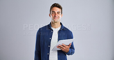 Buy stock photo Portrait, smile and tablet with editor man in studio for proofreading article of online magazine. App, column and post editing with happy freelance journalist on white background space for publishing