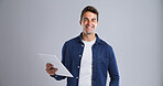 Tablet, man and happy with portrait in studio for social media, internet and website app. Smile, model and student on white background with technology for digital networking, scholarship or research