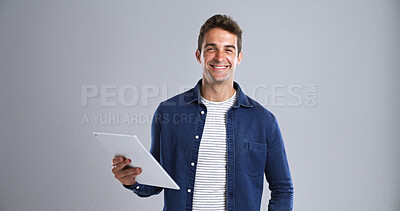 Buy stock photo Tablet, man and happy with portrait in studio for education, internet and website app. Smile, model and student on white background with tech and space for digital networking, scholarship or research