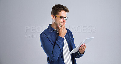 Buy stock photo Programmer, tablet or man with thinking in studio for software glitch, planning or troubleshooting. Mockup, web developer and confused with coding mistake, system solution or test on white background