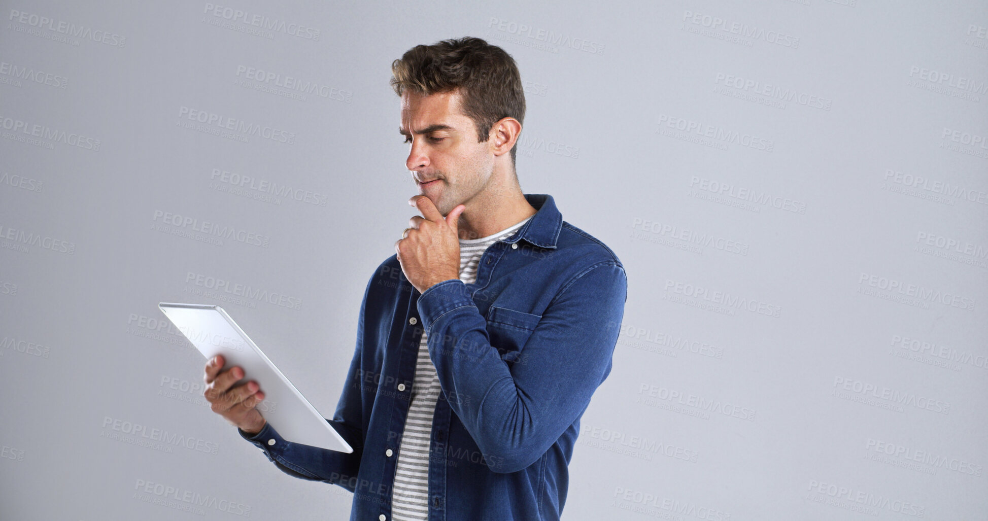 Buy stock photo Online, tablet and man with thinking in studio for website update, app download and solution. Space, confused user and doubt on white background with 404 error, connection fail and problem solving