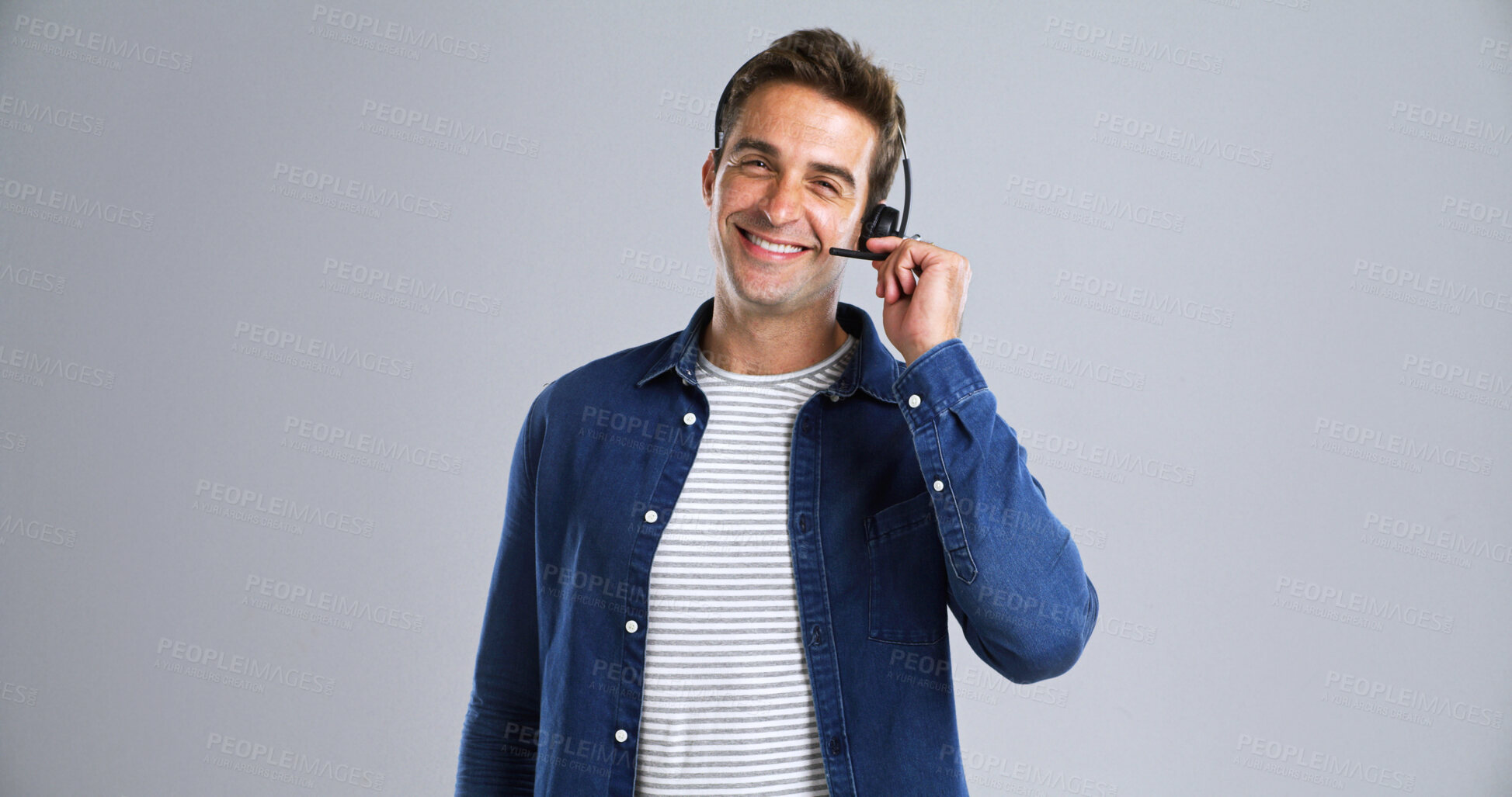 Buy stock photo Headset, man and portrait of call center agent in studio for CRM, customer care or service. Happy, mic or male technical support consultant with help desk or lead generation by white background space