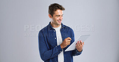 Buy stock photo Tablet, man and journalist in studio with research for creative project with online article. Happy, digital technology and male copywriter with startup business for multimedia by white background.