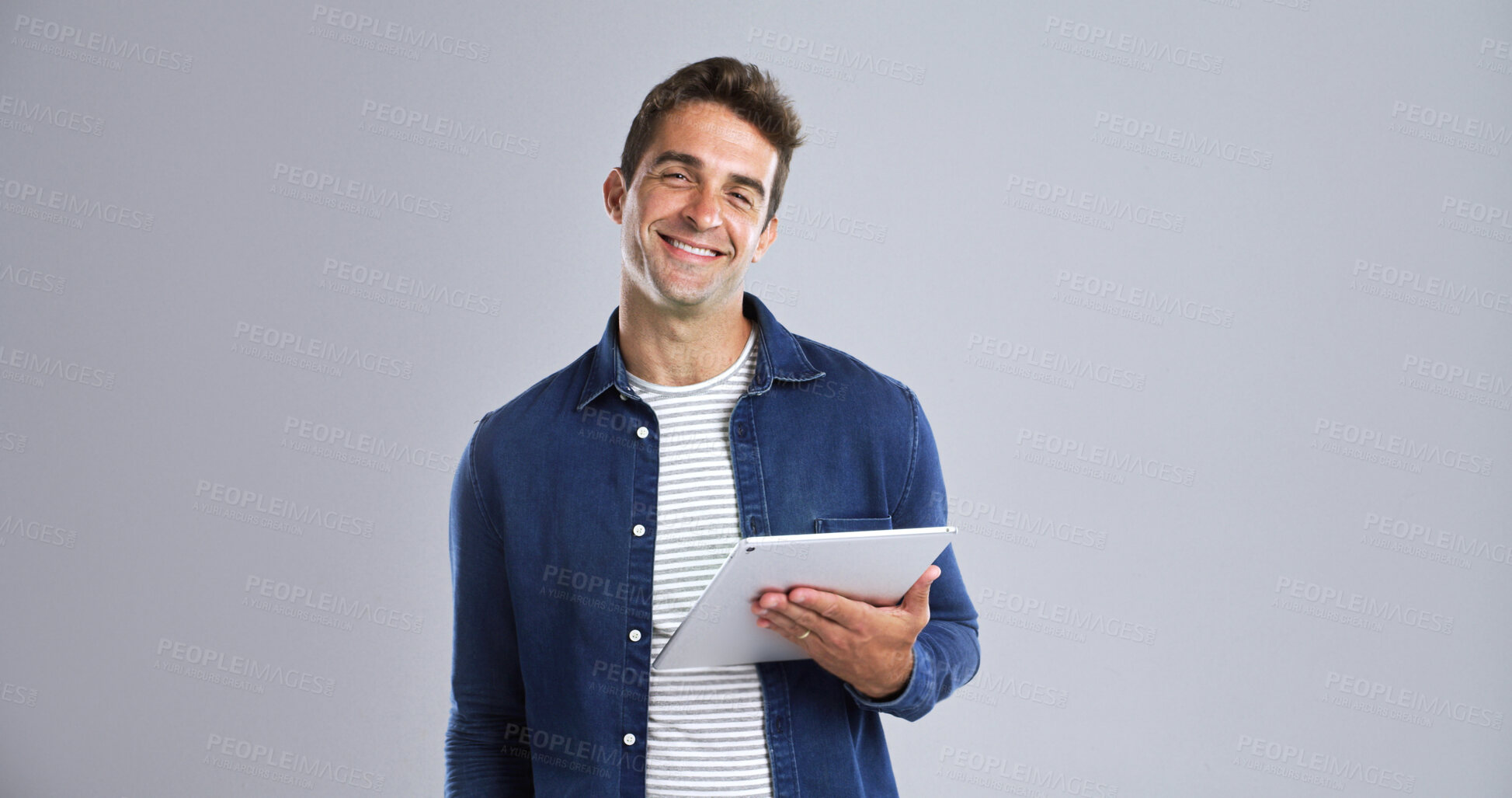 Buy stock photo Tablet, student and happy with portrait in studio for social media, internet and website app. Smile, model and man on white background with technology for digital networking, scholarship or research