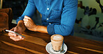Cafe, coffee and hands with smartphone for scroll, online communication and chat on social media. Closeup, person and espresso cup with mobile for application, message and connection on restaurant