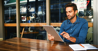 Buy stock photo Cafe, man and reading on tablet for remote work, article information or online blog for publication. Coffee shop, male person and content writer with digital for freelancer, newsletter and editing