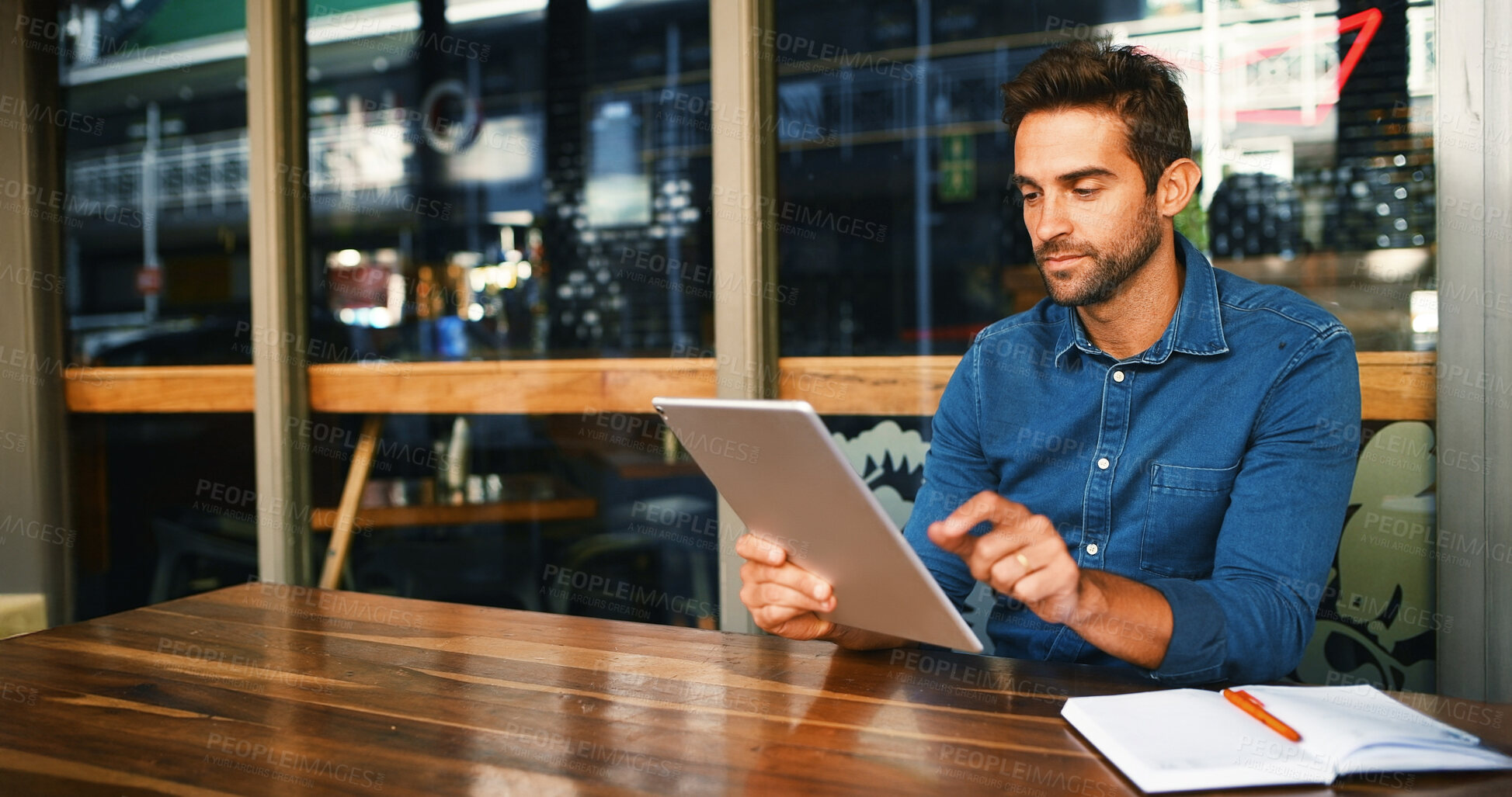 Buy stock photo Cafe, man and reading on tablet for remote work, article information or online blog for publication. Coffee shop, male person and content writer with digital for freelancer, newsletter and editing
