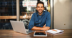 Laptop, portrait and tablet with man in coffee shop to research for small business startup. Computer, remote work and website with happy freelance employee in booth of cafe or restaurant as customer
