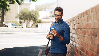 Buy stock photo Creative, man or texting with phone in city for travel, trip schedule or waiting on ride at bus stop. Professional, person or commute with smartphone on sidewalk for social media scroll or networking