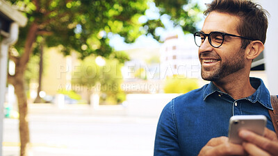 Buy stock photo Creative, man and smile with phone in city for travel, networking and taxi app for ride booking. Space, professional and commute with smartphone outdoor for text notification and social media scroll