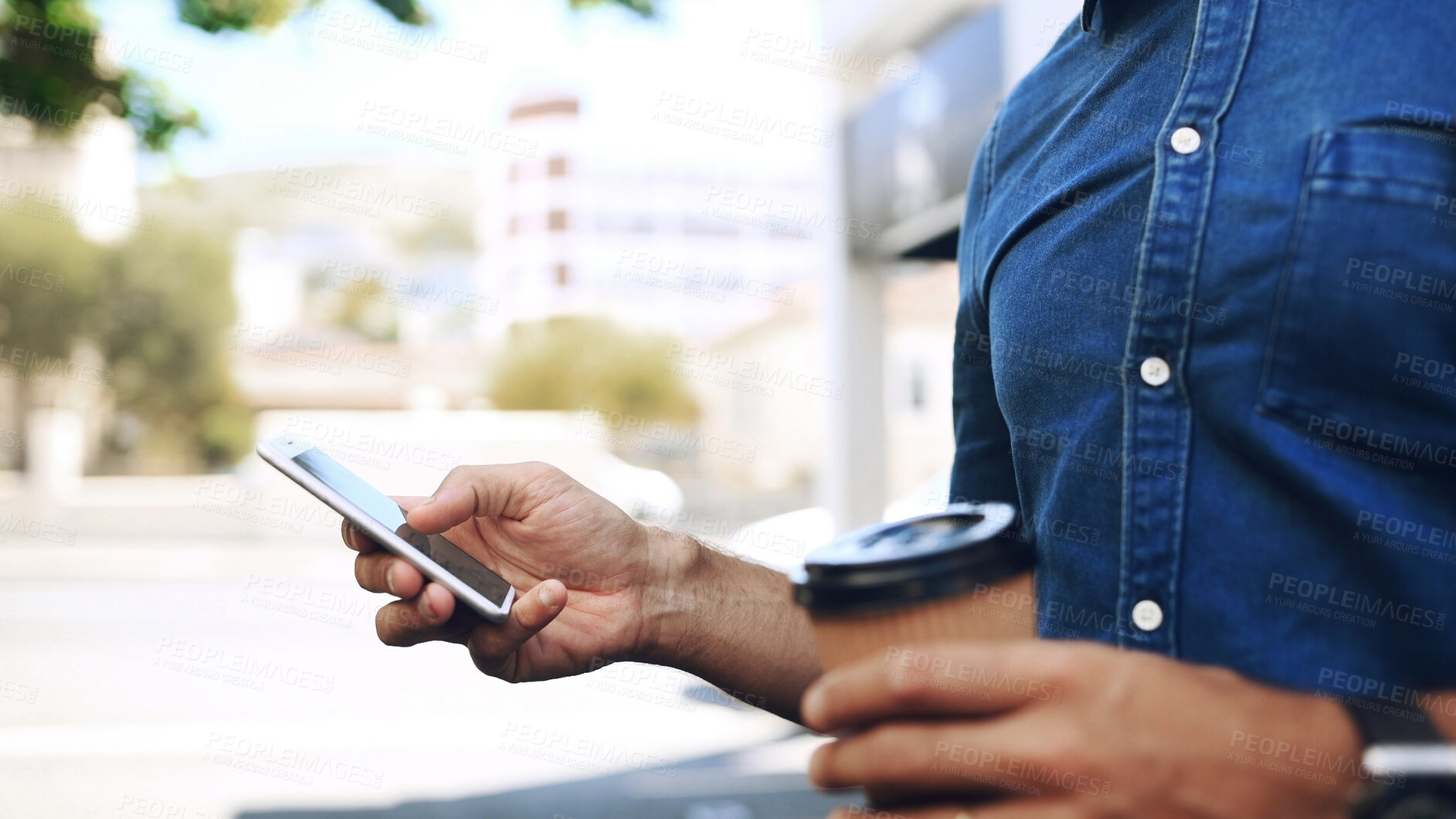 Buy stock photo Creative man, hand and phone in city for travel, networking and taxi app for ride booking. Professional, person and commute with smartphone for text notification, social media scroll and coffee