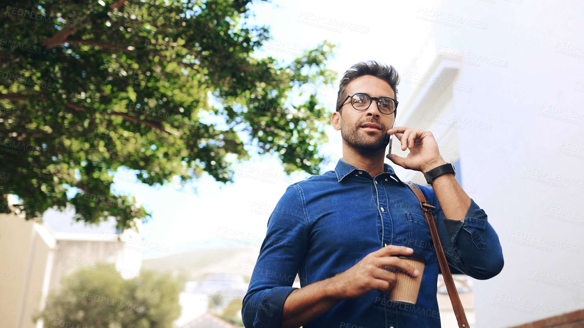 Buy stock photo Phone call, commute and man travel with conversation, connection and coffee. Creative person, walk and low angle with smartphone, contact and mobile communication for internship opportunity in city