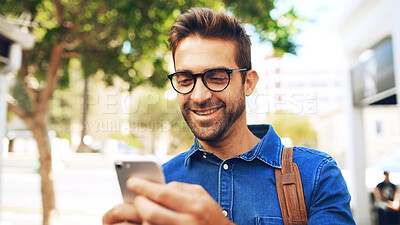Buy stock photo Creative, man and happy with phone in city for travel, networking and taxi app for ride booking. Professional, person and commute with smartphone outdoor for text notification or social media scroll