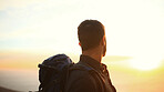 Man, hiking and ocean view at sunset for adventure, sky or backpack in nature in summer. Person, perspective and sightseeing by sea, mountain summit or cliff with trekking, outdoor or space in Greece