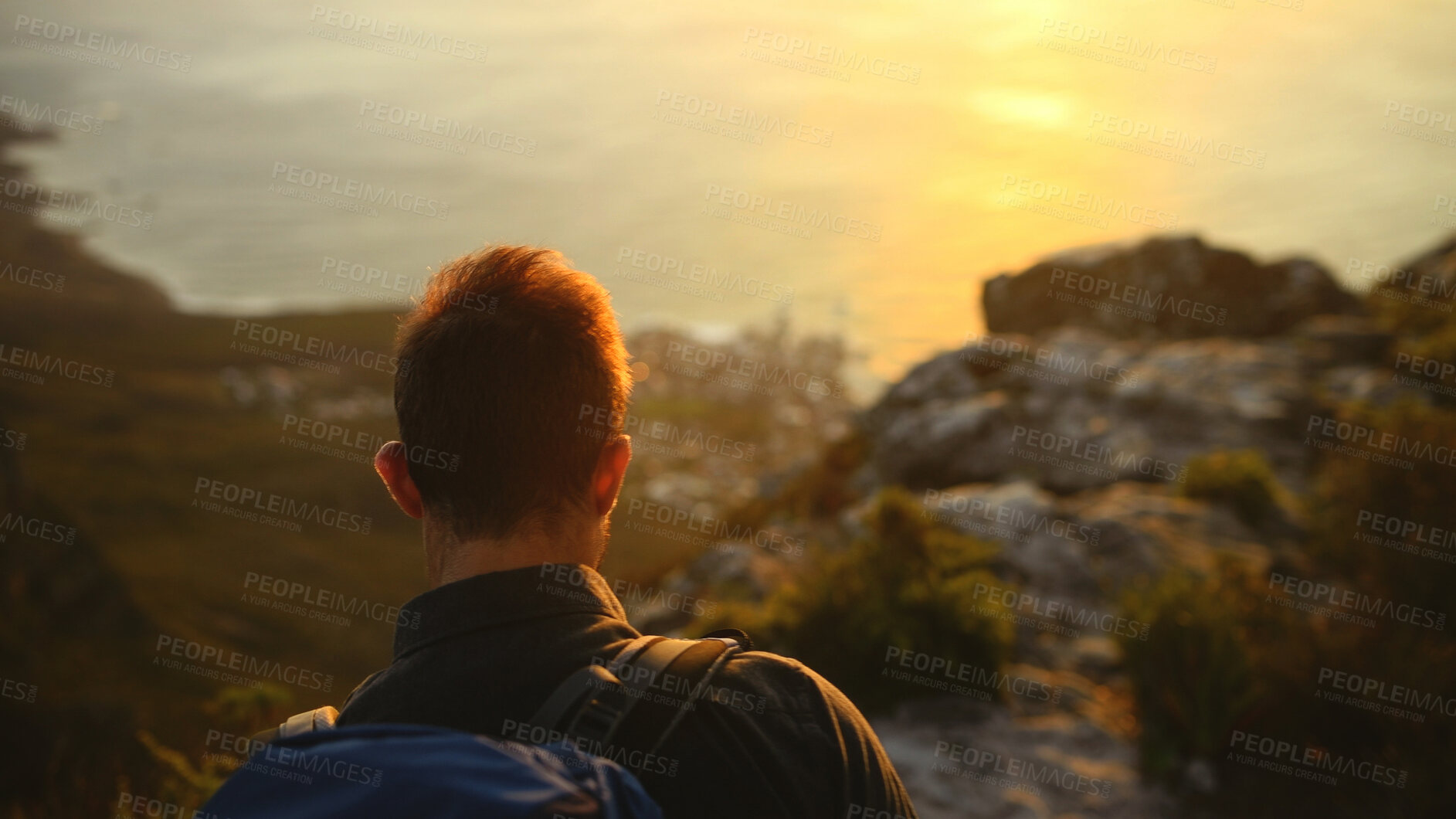 Buy stock photo Hiking, sunrise or man with backpack on mountain for travel adventure, sightseeing or ocean view. Back, hill or person outdoor for trekking break, backpacker journey or explore scenery at destination